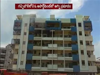 fire accident in apartment at gachibowli hyderabad - Sakshi