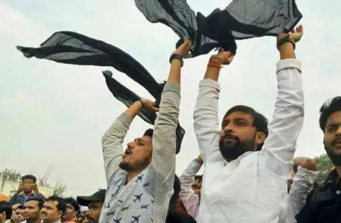 Black flags shown to Yogi Adityanath in Meerut - Sakshi