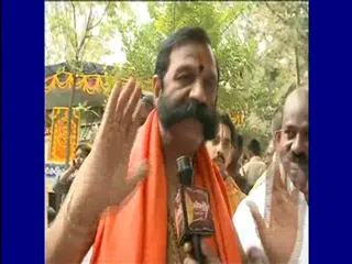 kanumuri bapiraju gets back on cases of devotees - Sakshi