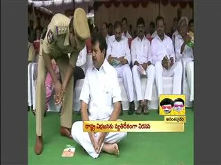 MLA Gurunath Reddy sitting on land - Sakshi