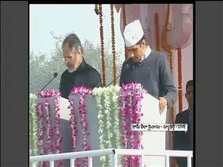 Arvind Kejriwal being sworn in as Delhi chief minister, sea of supporters present - Sakshi