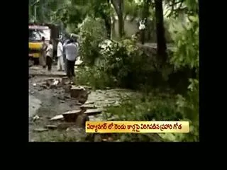 Compound Wall Collapses Crushing 2 Cars - Sakshi