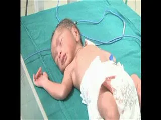 New born slips through train toilet in anantapur - Sakshi