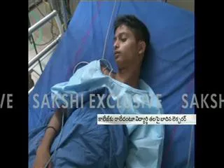 Boy beaten up by college lecturer - Sakshi