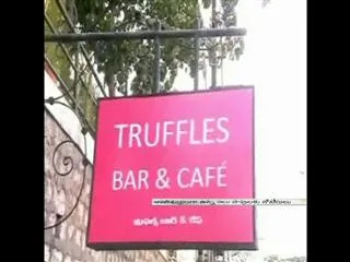 GHMC officers attack on coffee shop - Sakshi