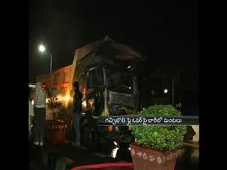 Lorry catches fire on gachibowli flyover - Sakshi
