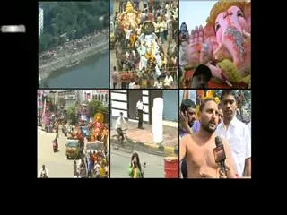 Devotees special poojas at Khairatabad Ganesh - Sakshi