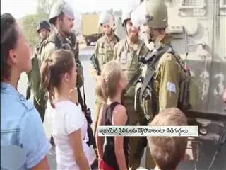 Palestine girl questions Israel soldiers - Sakshi