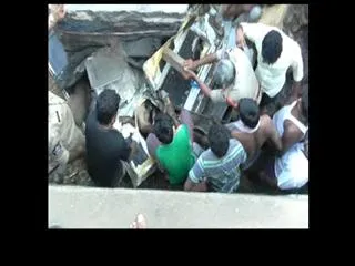 lorry accident in West Godavari Dist Driver and cleaner stuck in cabin - Sakshi
