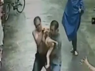 chinese-men-catch-baby-falling-from-building - Sakshi