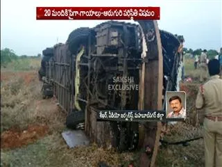 Kesineni Travels bus Overturned In Mahaboob Nagar - Sakshi