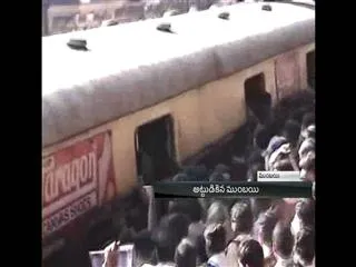 Suburban train services hit as angry commuters protest delays - Sakshi