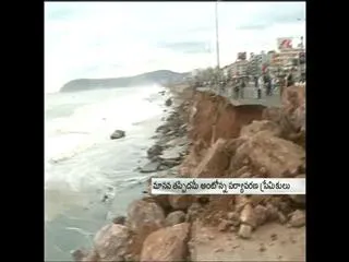 Huge tidal waves breaking RK Beach Road - Sakshi