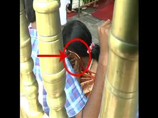 Board Chairman's Wife Cell phone Speaking in the Srivari temple - Sakshi
