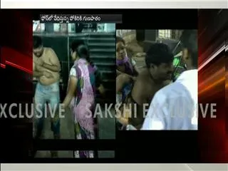 Woman beats man in public - Sakshi