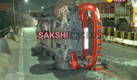 Car roll over on begumpet flyover - Sakshi