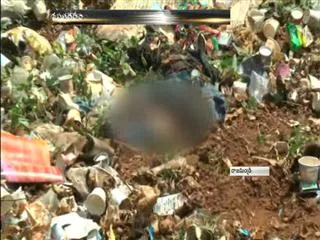newborn's body at garbage in rajahmundry - Sakshi