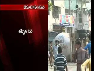 Gas tanker roll over in the outskirts of Visakhapatnam - Sakshi