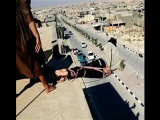 Horrific moment ISIS throw a man off the top of a building with his hands and feet tied after he is accused being gay - Sakshi