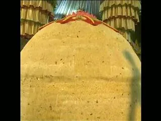 unidentified man trying to sell khairatabad ganesh laddu - Sakshi
