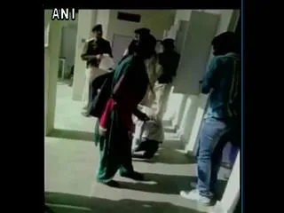Girl thrashes eve teasers with slippers inside a police station in Madhya Pradesh's Tikamgarh district - Sakshi