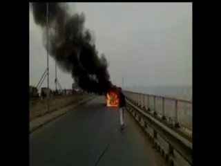 A Car Catches fire in Middle of Road in Allahabad - Sakshi
