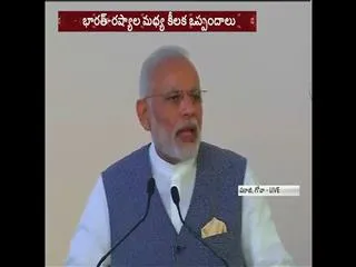 PM Modi, Putin witness exchange of 16 agreements - Sakshi