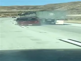 Truck recklessly drags car along motorway in California - Sakshi