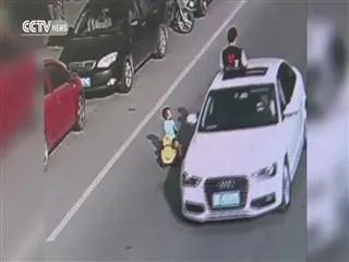 chinese toddler goes to middle of a busy road with his toy car - Sakshi