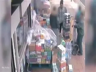 drunk woman throws stock, racially abuses shop staff and blocks customers entering a store - Sakshi