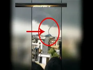 Clouds on a house at Karimnagar looks like a tornado - Sakshi
