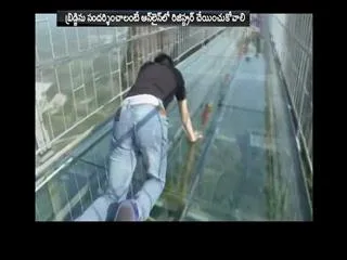 World highest glass bridge reopens in china, no high heels allowed - Sakshi