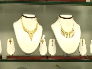 Gold notches two-week high on expectations Fed will lift rates slowly - Sakshi