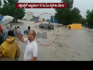 buses stranded in flood water, trains also effected in guntur district - Sakshi