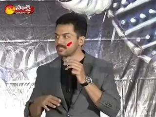 hero karthi moustache falls in middle of kashmora movie press meet - Sakshi