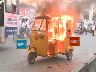 Auto fire accident at Khairatabad, hyderabad - Sakshi