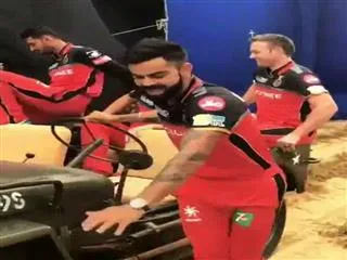 Virat Kohli drives teammates in vintage jeep, tweets video - Sakshi