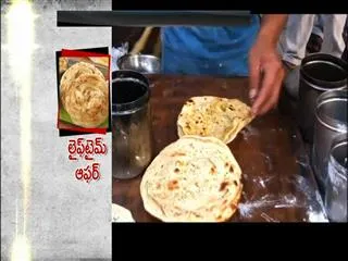 Eat 3 Paratha in an hour, get free food for lifetime - Sakshi