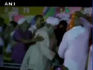 Lalu Prasad suffered minor injuries after he fell down following a stage collapse - Sakshi