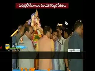 Madhya Pradesh CM Shivraj Singh Chouhan immersing an idol of Lord Ganesh - Sakshi