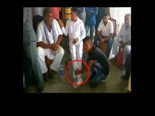 MLA Husband Massage Legs at Press Meet in Rajasthan - Sakshi