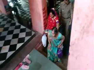 PM Narendra Modi's wife worships at Mathura temple - Sakshi