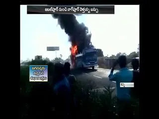 bus catches fire in madhya pradesh - Sakshi
