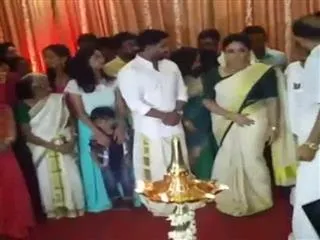 Malayalam actress Kavya madhavan, Dileep tied knock - Sakshi