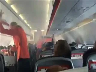 mid air smoke in flight creats panic in passengers - Sakshi