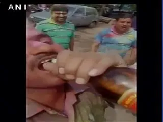 Policemen drinking beer inside a Police station - Sakshi