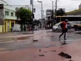 Motor cyclist slips into pothole filled with water - Sakshi