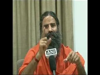 ramdev baba speaks about denomination currency notes - Sakshi