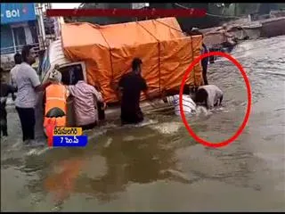 Man Falls in Flood Water at Nacharam || Hyderabad - Sakshi