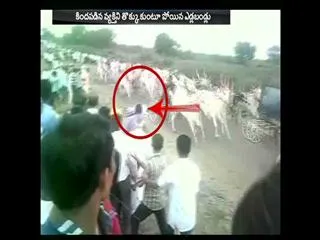Farmer injured in bull race at karnataka - Sakshi
